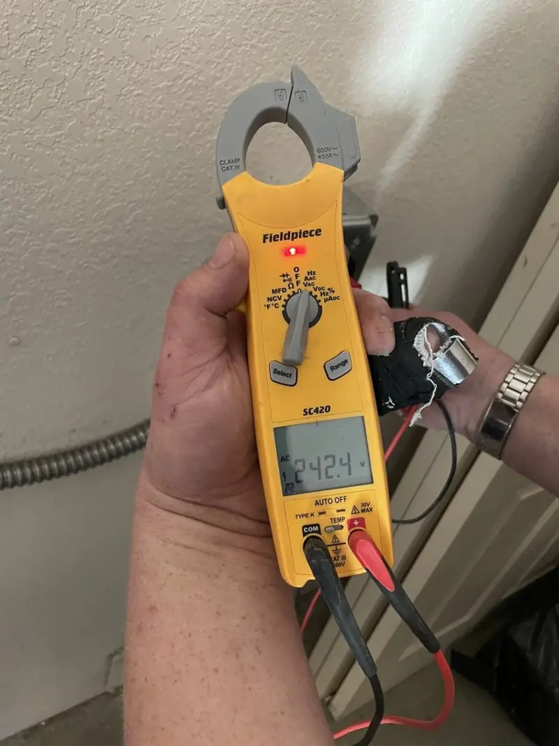 Voltage testing with clamp meter during Ceiling Fan Installation in Delano